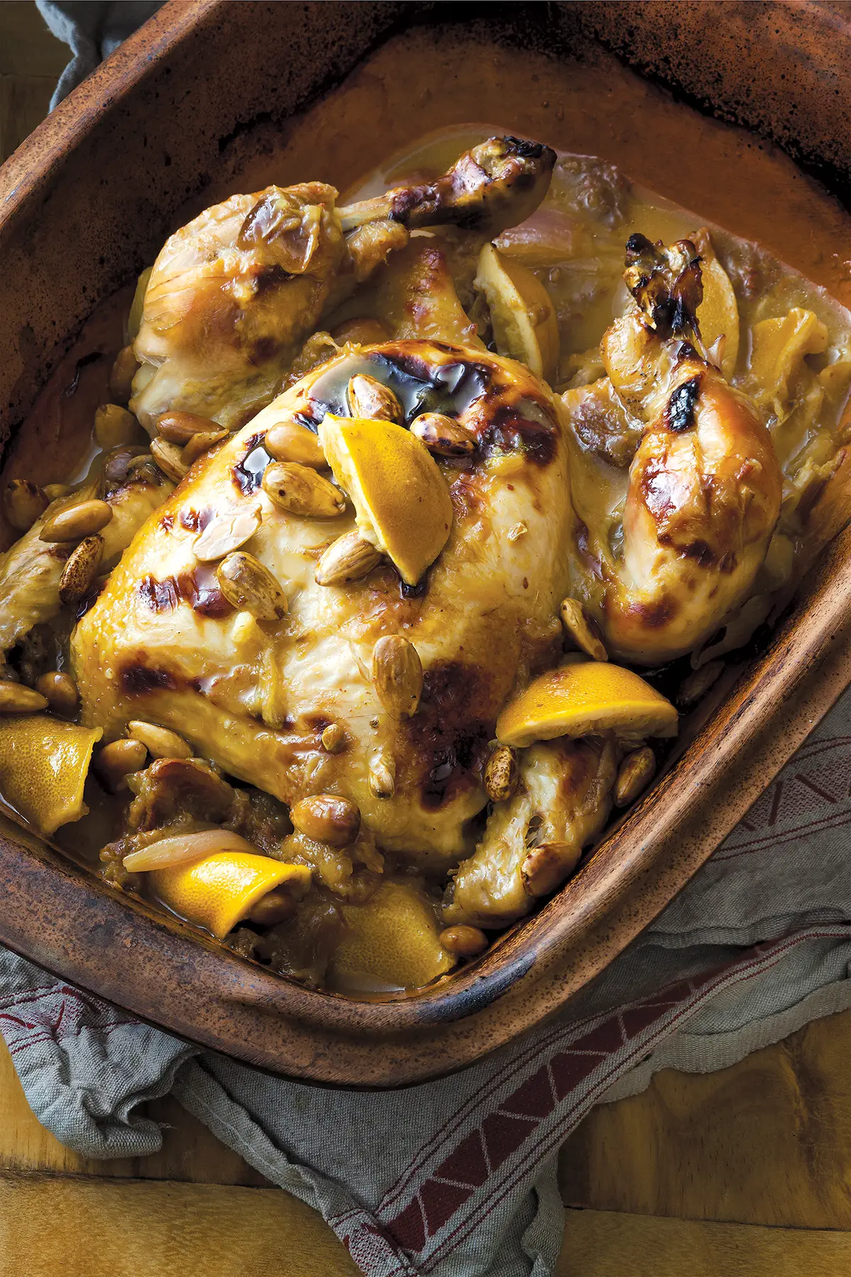 Whole Roasted Chicken in Clay Pot with Almonds, Dates and Lemons