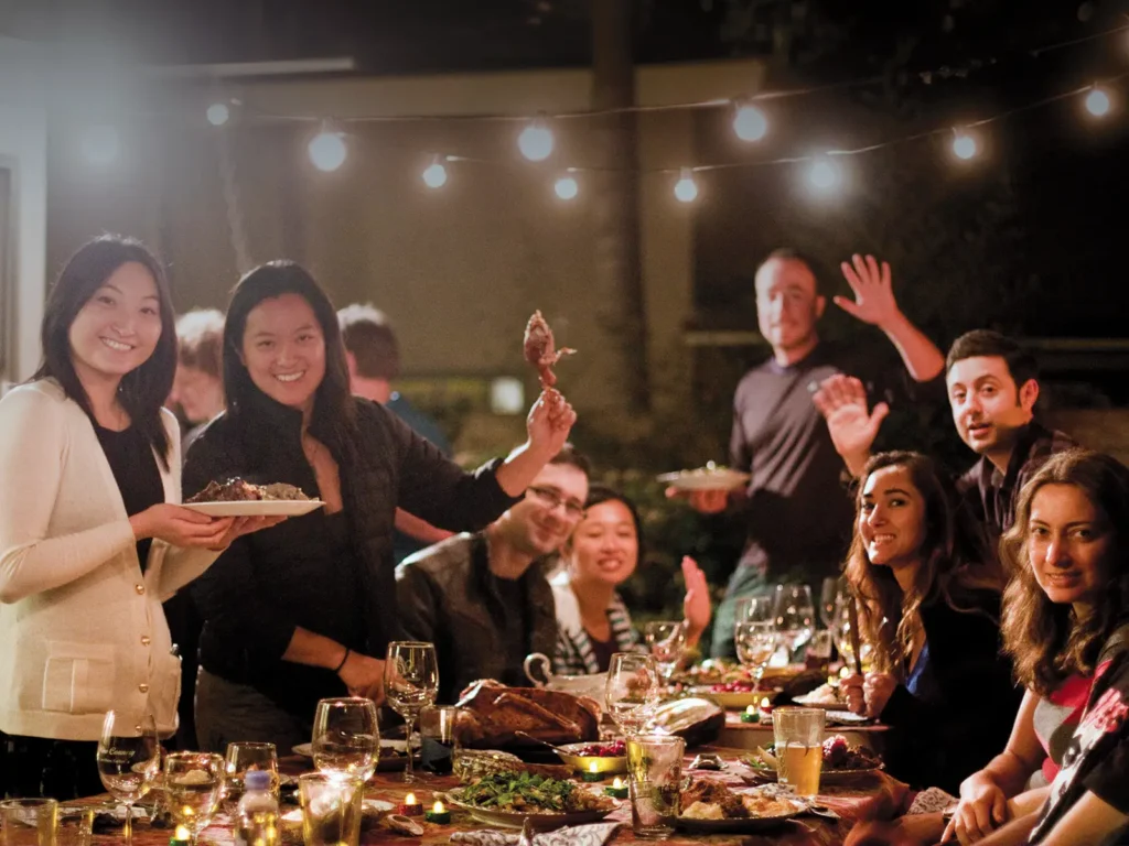 Gathering at a long table for a Friendsgiving feast on the Mesa in Santa Barbara.