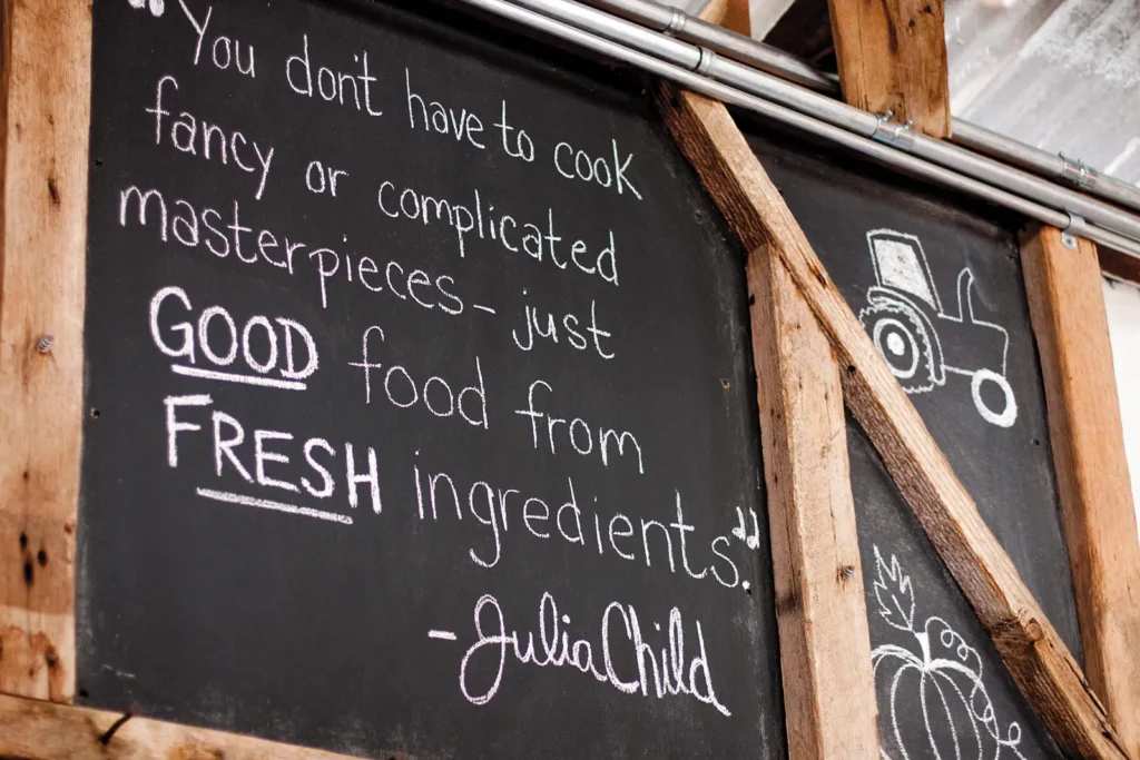 Blackboard containing the Julia Child quote "You don't have to cook fancy or complicated masterpieces - just good food from fresh ingredients."