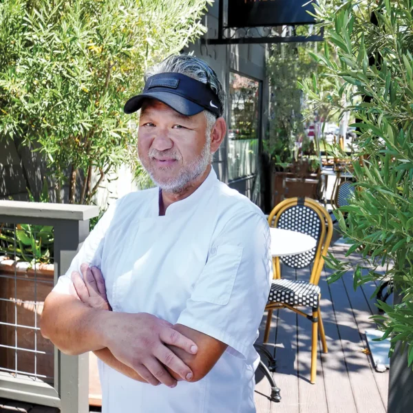 Longtime valley resident Chef Budi Kazali on the patio of The Gathering Table in Solvang.