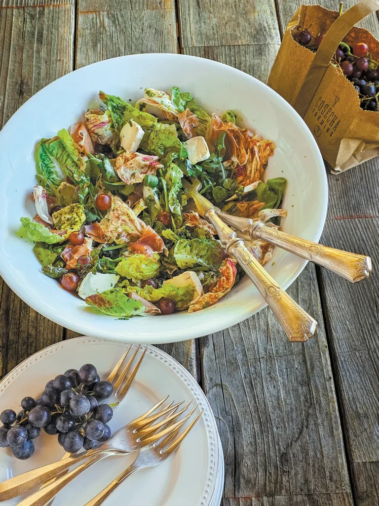 A bowl of Grape Harvesters Salad with Pesto Vinaigrette.