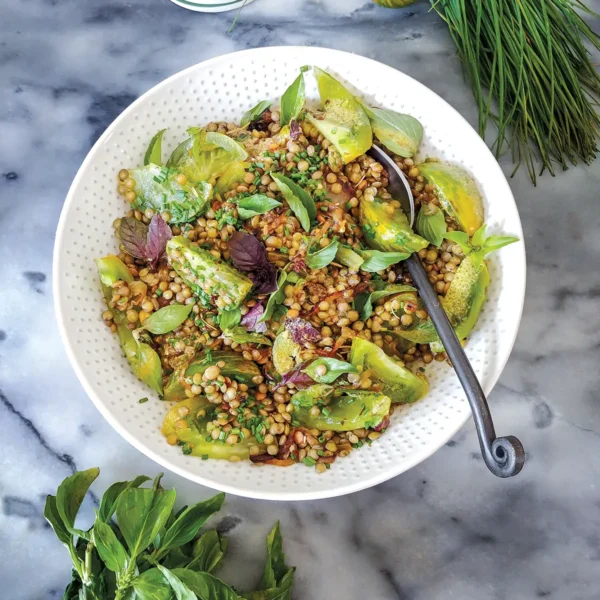 A bowl of Lentils with Glazed Onions and Green Tomatoes.