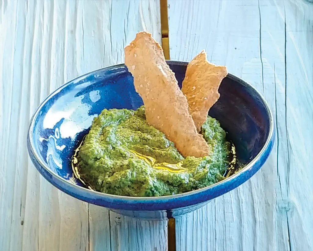 A bowl of Pea and Mint Hummus.