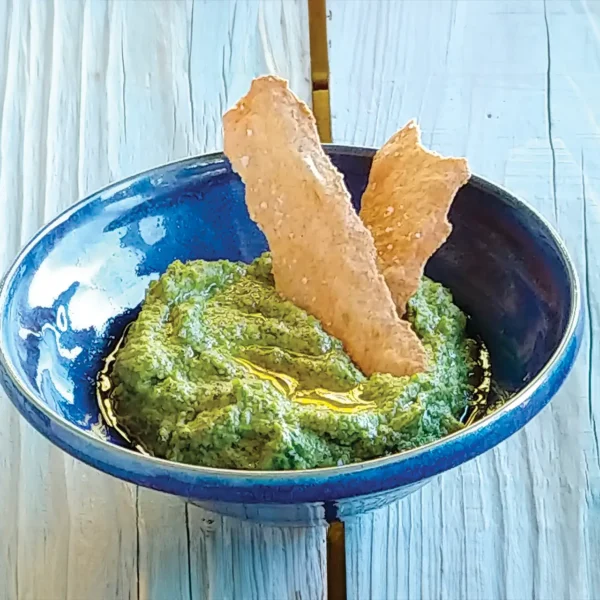 A bowl of Pea and Mint Hummus.