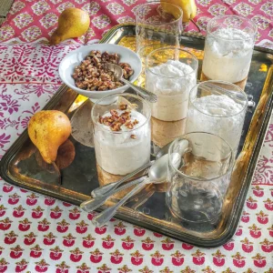 A tray holding pears and glasses of pear mousse.