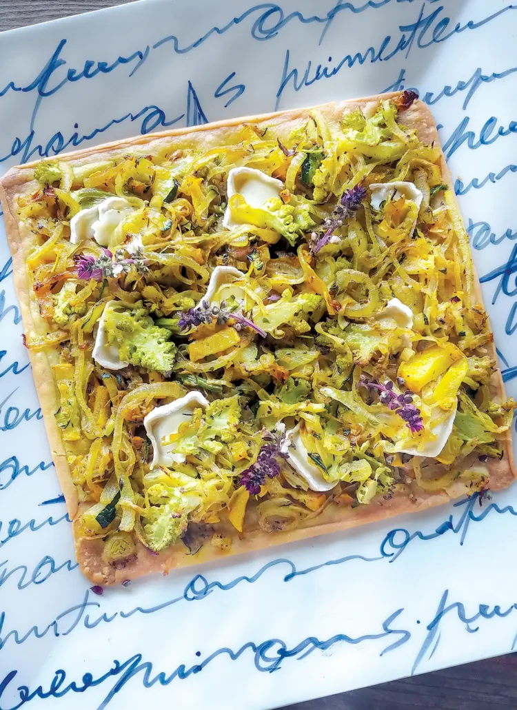 Pissaladière on a square plate.