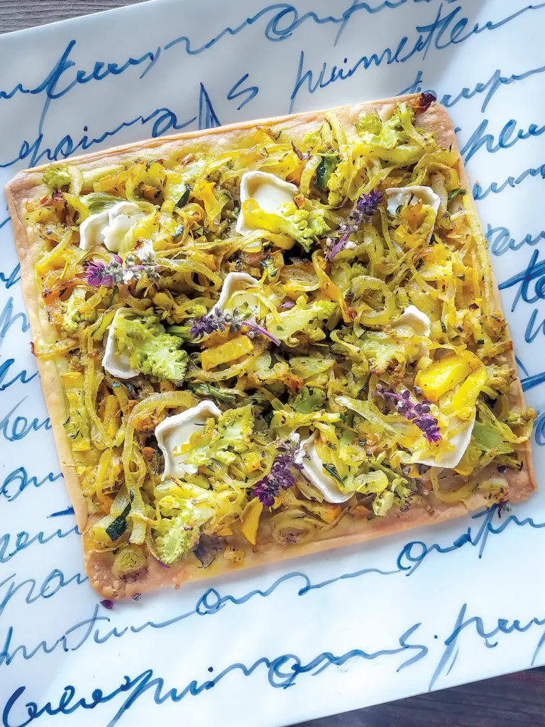 Pissaladière on a square plate.