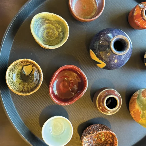 Assorted cups and bowls representing koyo, or autumn colors at Yoichi's.