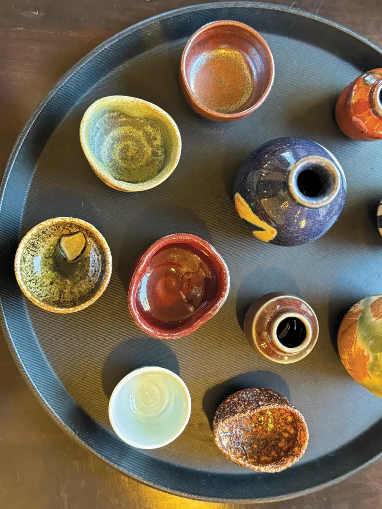 Assorted cups and bowls representing koyo, or autumn colors at Yoichi's.