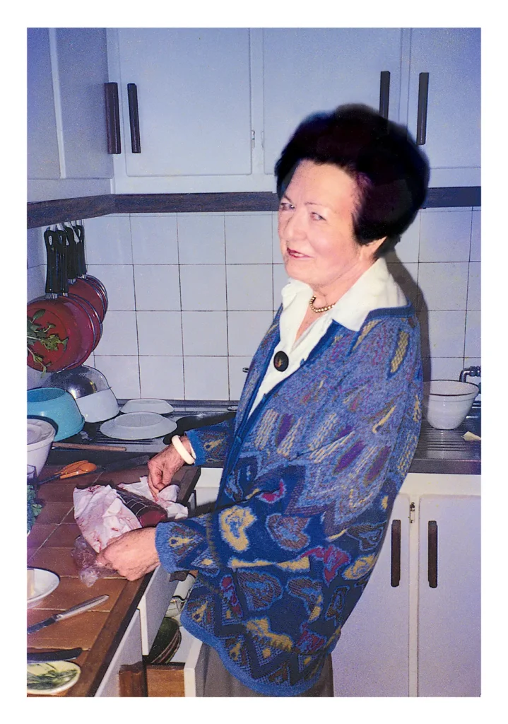 Geneviéve Fay preparing a meal in her kitchen.