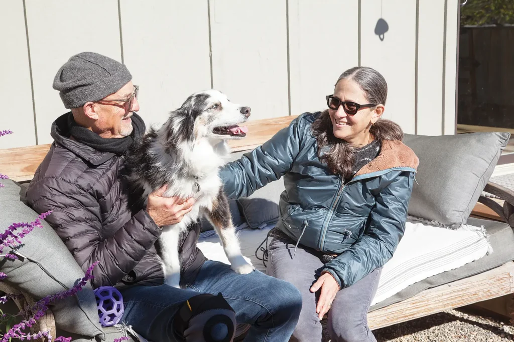 Laura and Jim with Honeybear, their Australian shepherd dog.