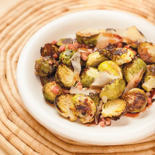 Roasted Brussels Sprouts presented in a white bowl.