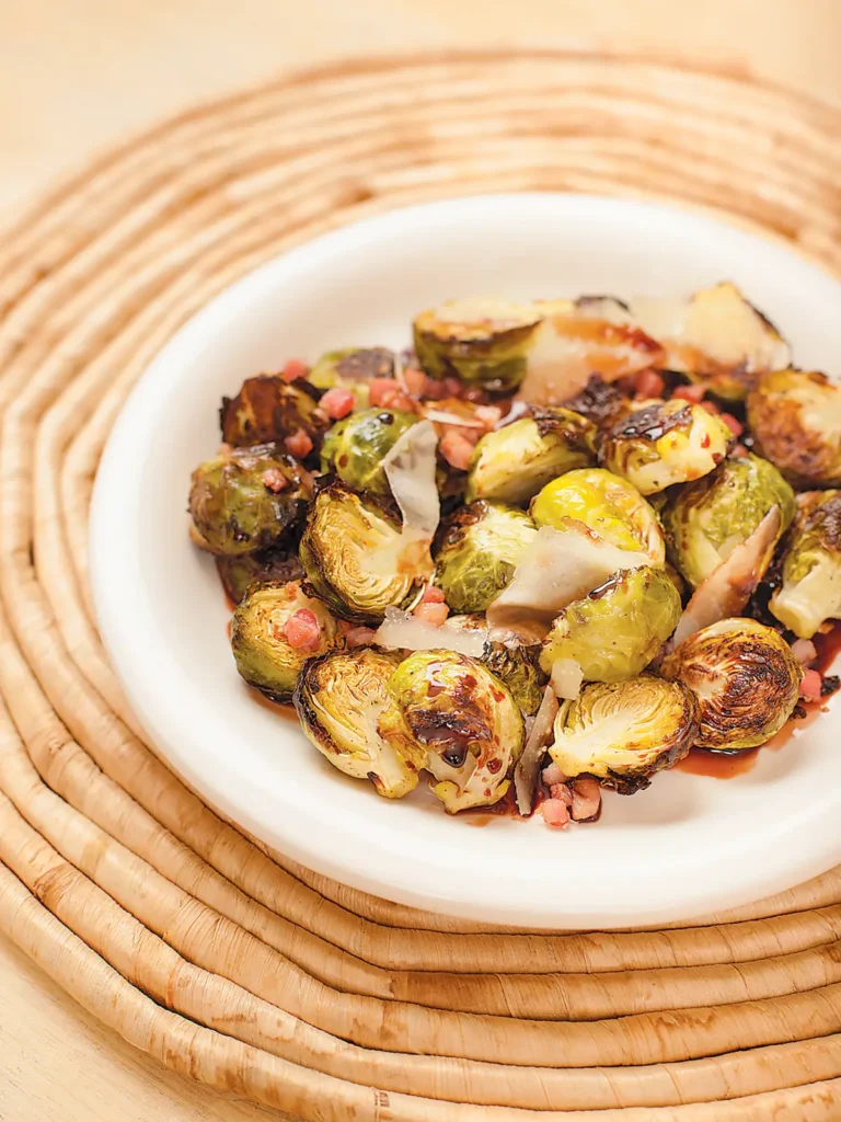 Roasted Brussels Sprouts presented in a white bowl.