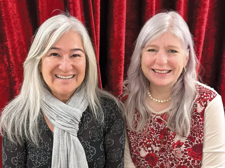 Rosminah Brown and Krista Harris against a red velvet background.