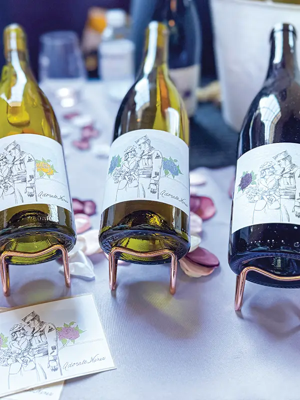 Bottles of Adorato wine on a table.
