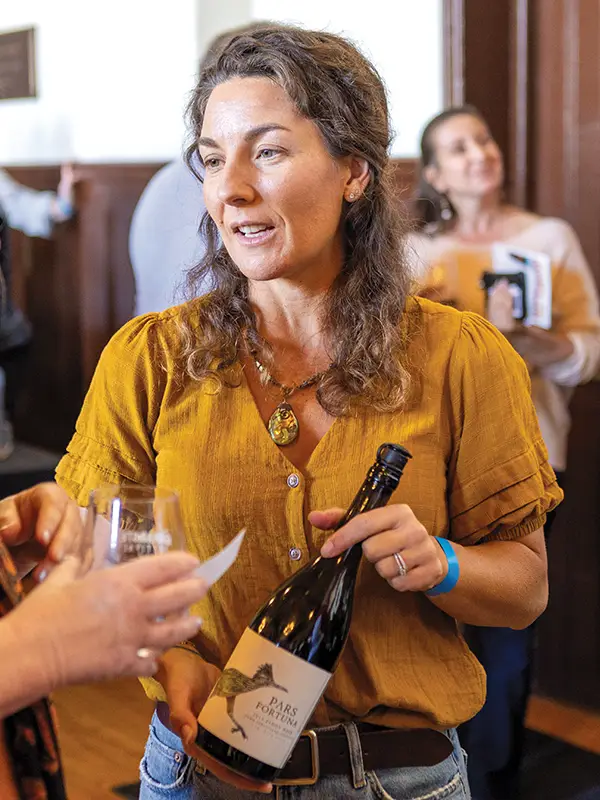 Kira Malone of Pars Fortuna Wine talking with a guest.