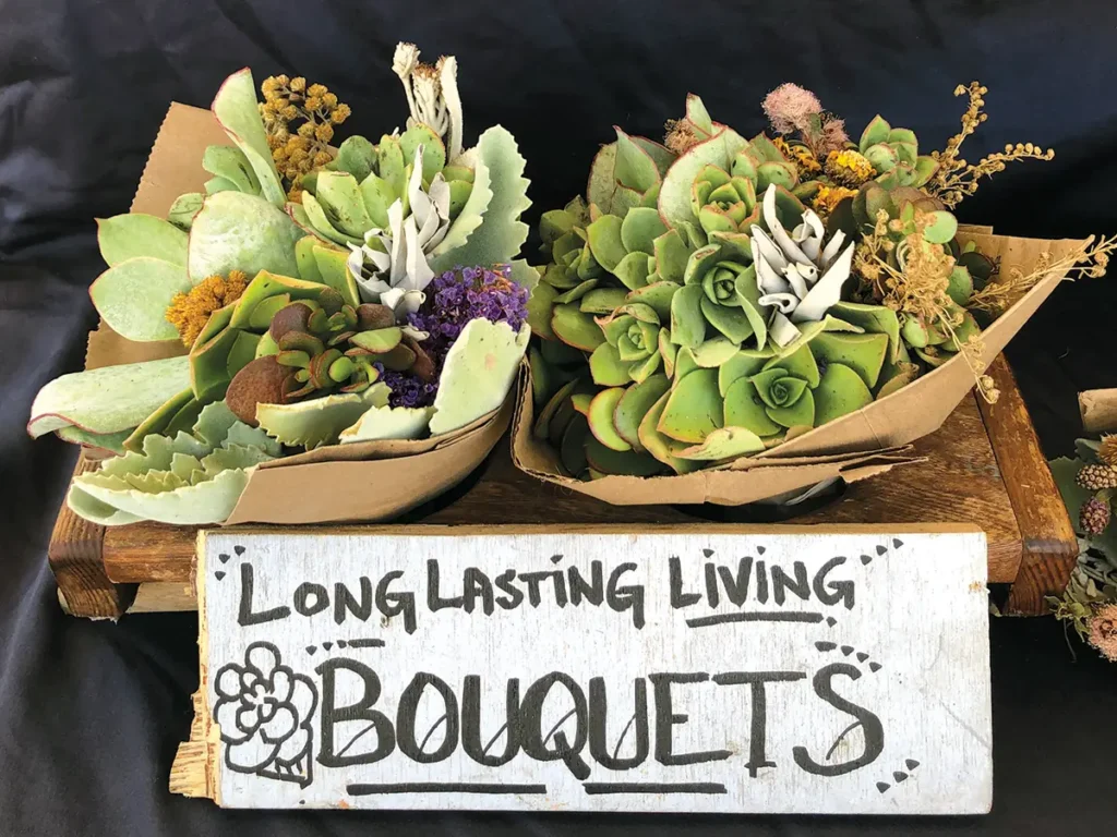 Sign reading "Long Lasting Bouquets" with two bouquets for sale.