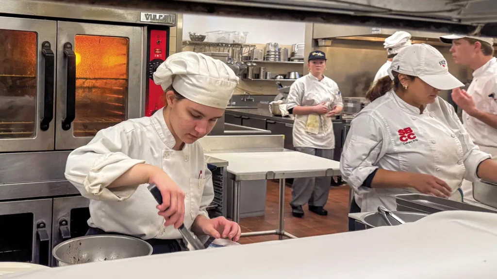 Advanced culinary students on the line.