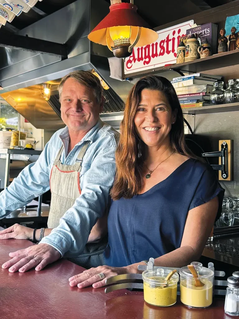 Charlie and Jen Fredericks standing behind the bar at the Dutch Garden.