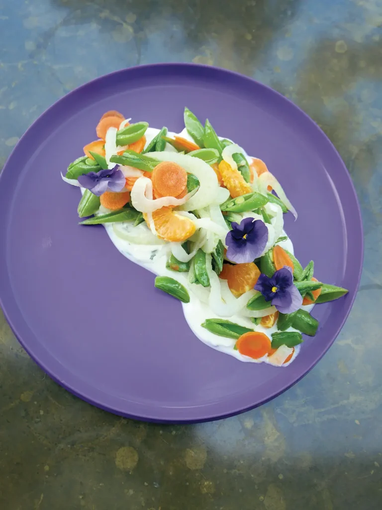 Plated Yuzu Snap Pea Salad with Vegan Aioli at Satellite.