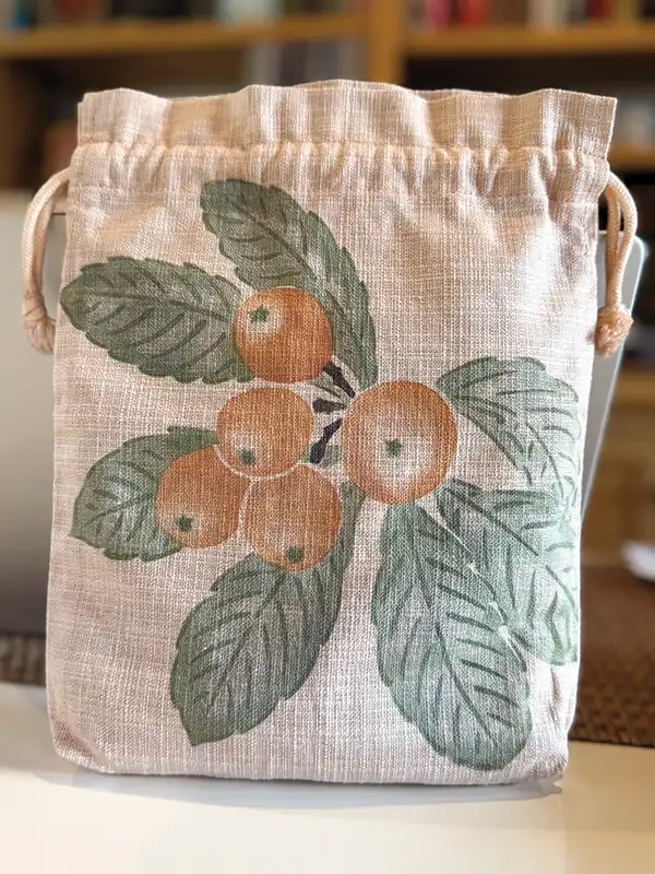 Silk bag died with loquat leaves and branches then stenciled.