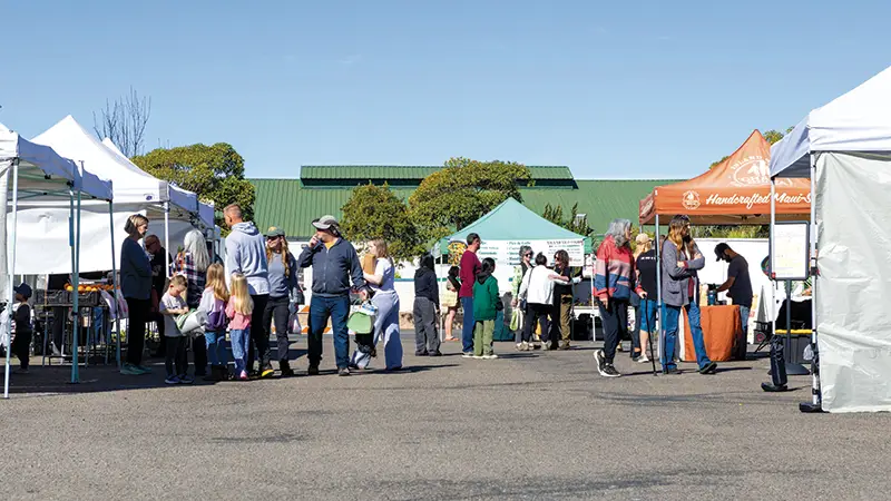 Customers and vendors come together at the Route One Farmers Market.