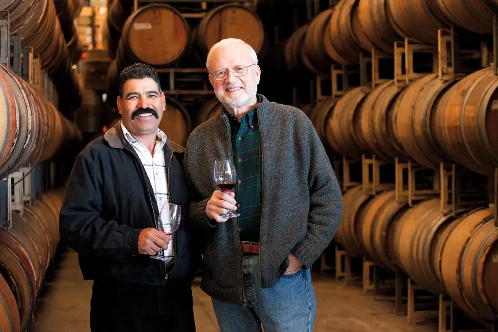 Ruben Camacho and Ken Brown pose in the barrel room.