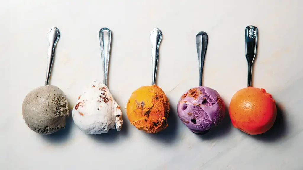 5 spoons each with a colorful scoop of Creaminal ice cream on the end in a horizontal row.
