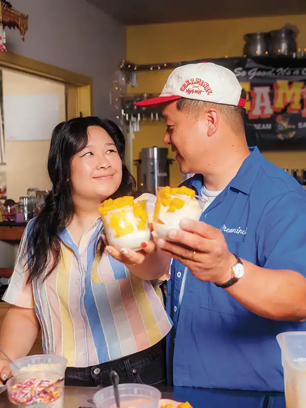 Kathy Dao and Piti Sukavivatanachai hold two mango stick rice sundaes at their popular weekly pop-up.