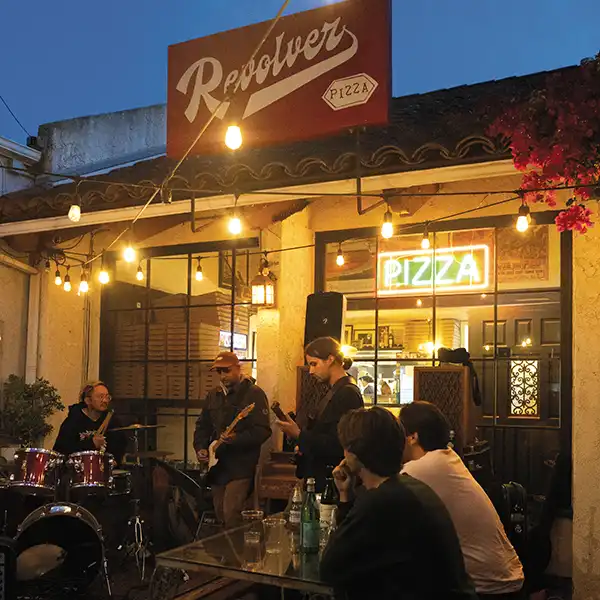 A Wednesday night jam session in front of Revolver Pizza.