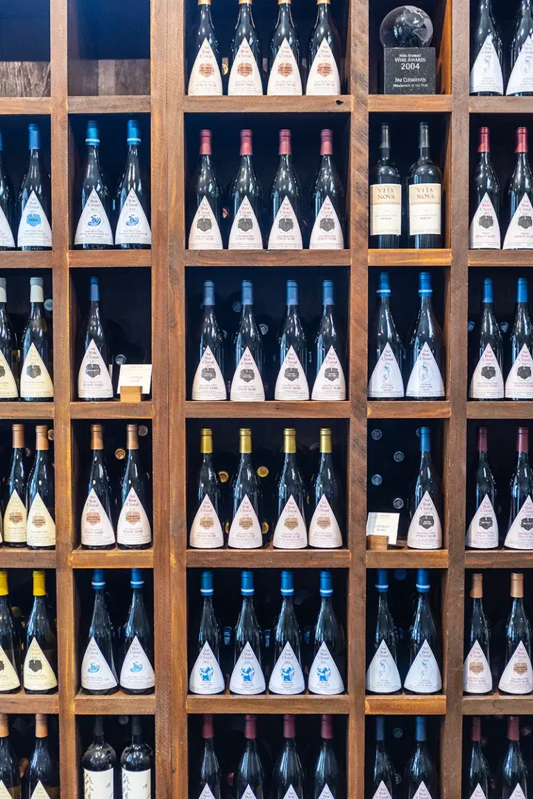 Library shelves full of ABC bottles.