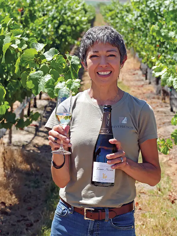 Clarissa Nagy of Riverbench toasts the new vintage in the vineyard.