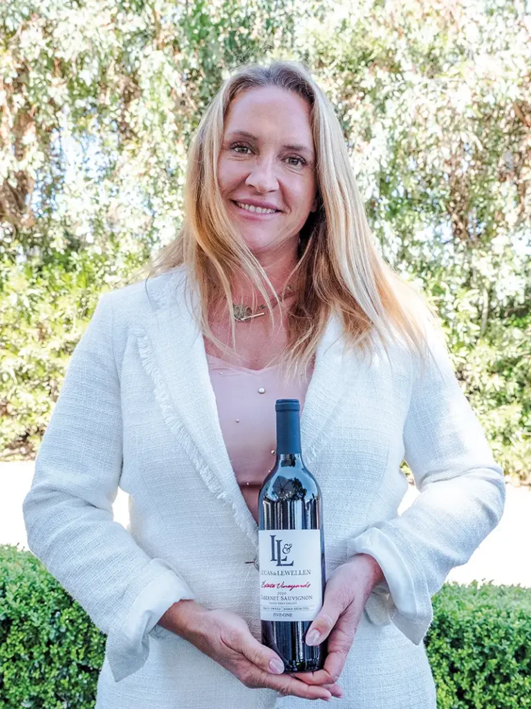 Megan McGrath holds a bottle of (Lucas & Lewellen.
