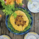 Caramelized Onion Galette set on a wooden table.