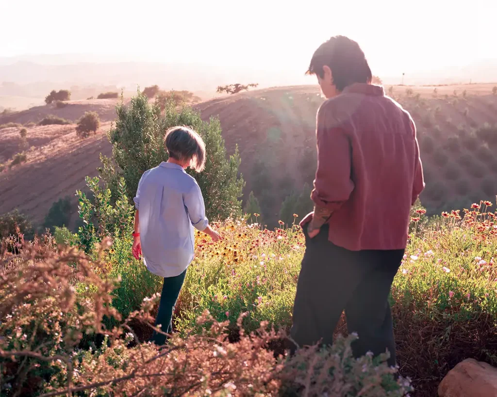 Elise Magistro and Taylor Yamashiro in the olive grove.