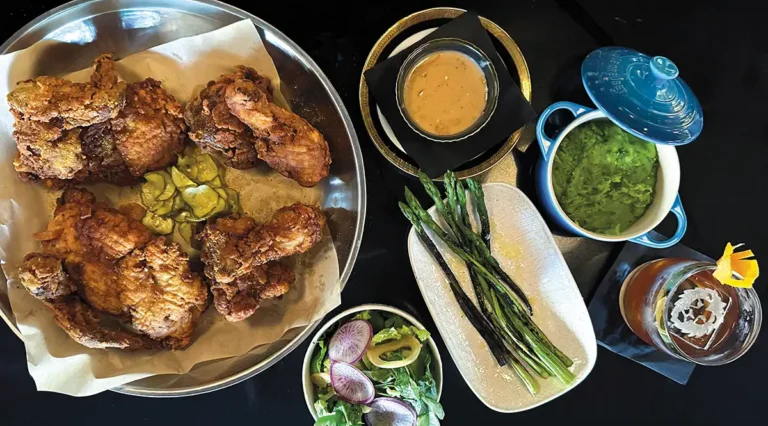 Fried chicken, sides, and a delicious cocktail at Lions Tale.